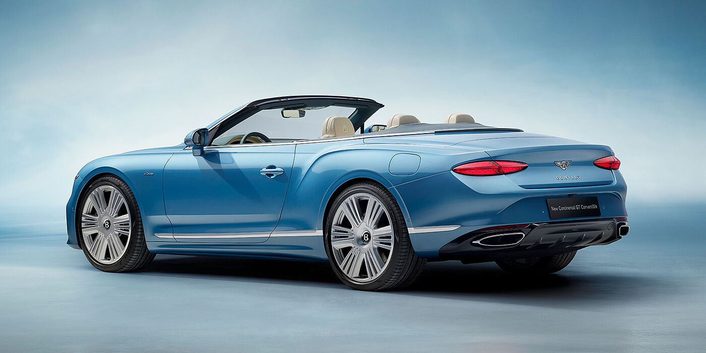 Bentley Tunbridge Wells New Bentley Continental GTC Azure convertible rear view in Light Windsor blue paint with 22 inch ten spoke wheels and chrome exterior details