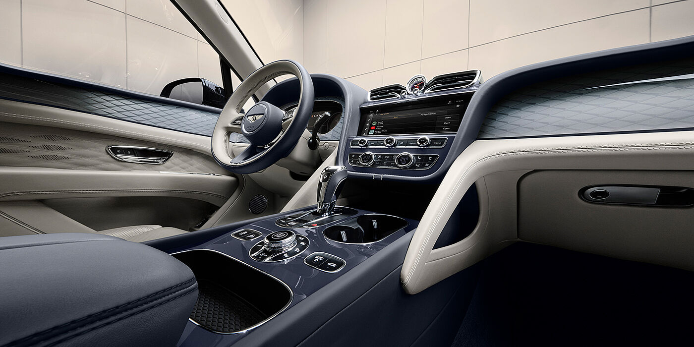 Bentley Tunbridge Wells Bentley Bentayga Atelier Edition SUV front interior in Linen and Imperial Blue hides with Dark Tint Diamond Brushed Aluminium veneer