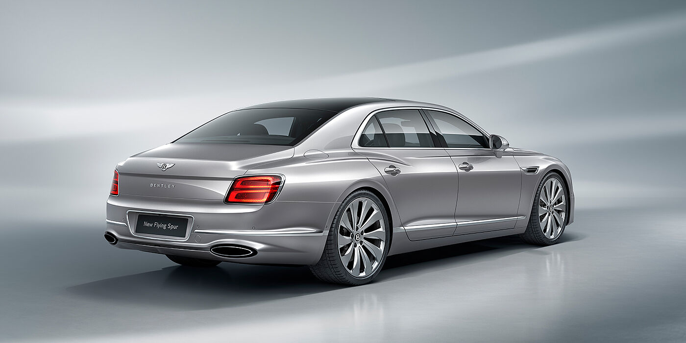 Bentley Tunbridge Wells New Bentley Flying Spur sedan rear view in Silverlake paint with ten spoke wheels and chrome matrix grille