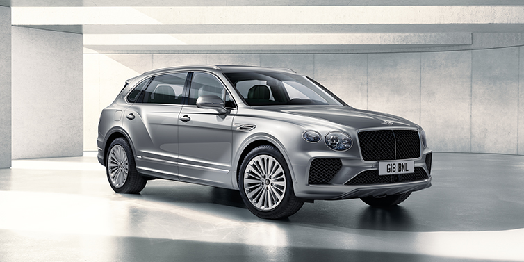 Bentley Tunbridge Wells Bentley Bentayga Extended Wheelbase SUV front three quarter in Moonbeam paint with a grey background