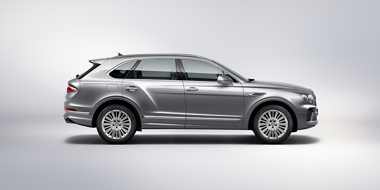 Bentley Tunbridge Wells Bentley Bentayga SUV side profile in Moonbeam silver paint against white background featuring 21 inch 5 spoke wheels