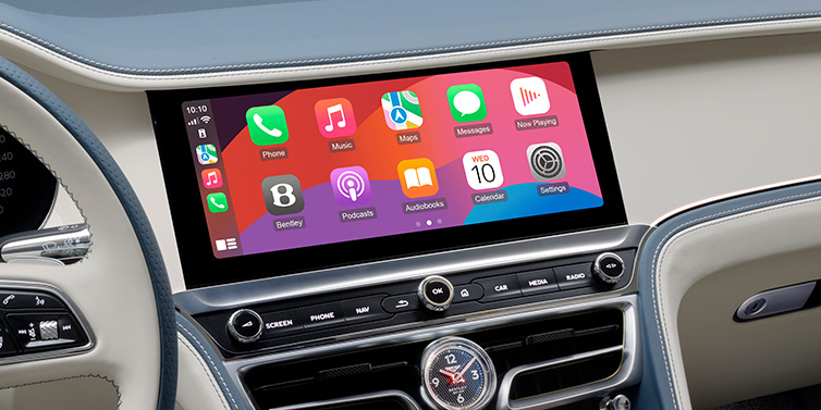 Bentley Tunbridge Wells New Bentley Flying Spur Azure sedan front cabin central MMI screen showing available services against Linen and Brunel hides and Piano Linen veneer